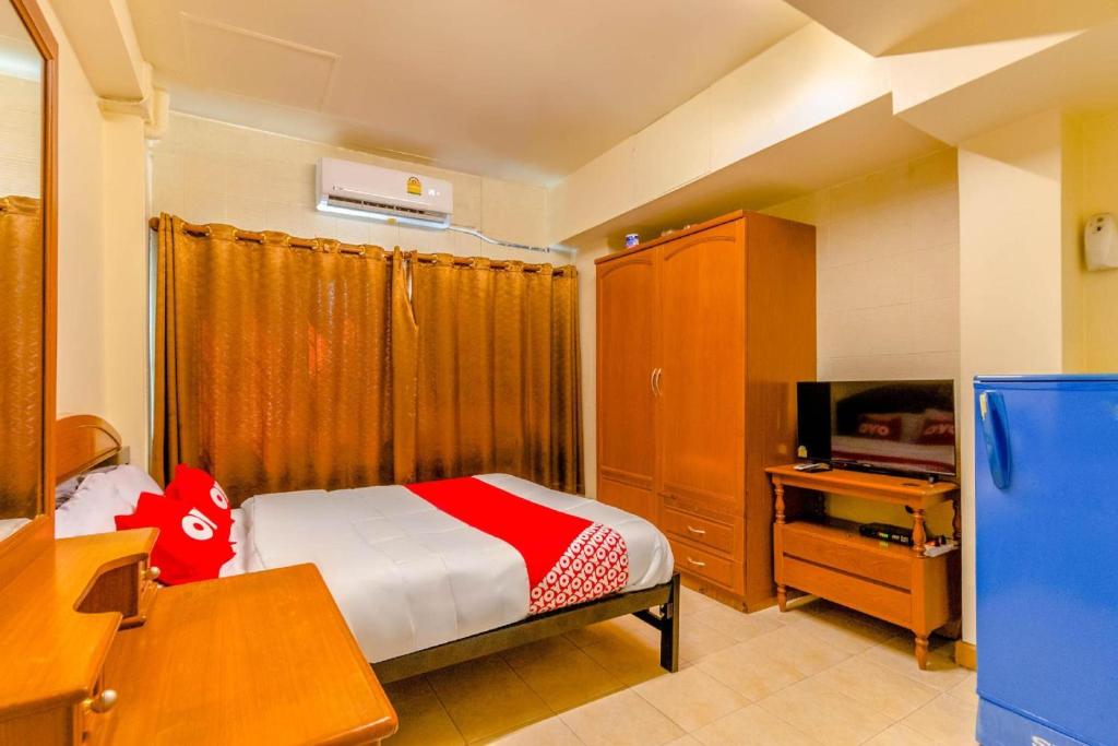 Postel nebo postele na pokoji v ubytování OYO 583 Sweethome Guest House