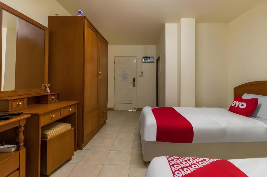 Postel nebo postele na pokoji v ubytování OYO 583 Sweethome Guest House