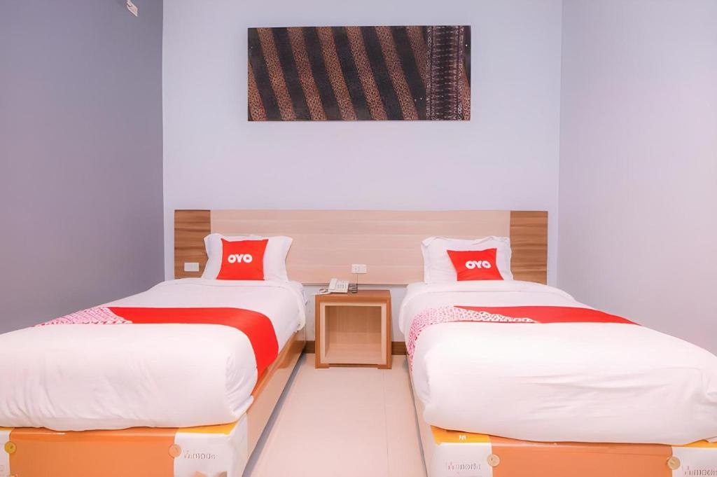 Postel nebo postele na pokoji v ubytování Marian Kisad Hotel
