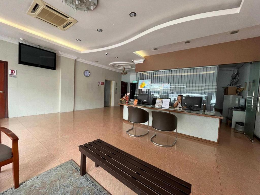 TV a/nebo společenská místnost v ubytování OYO 91037 Atari Inn