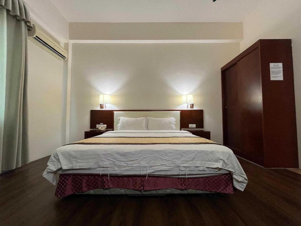 Postel nebo postele na pokoji v ubytování OYO 91037 Atari Inn