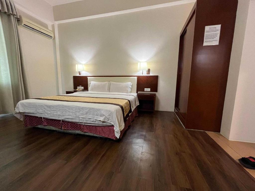 Postel nebo postele na pokoji v ubytování OYO 91037 Atari Inn