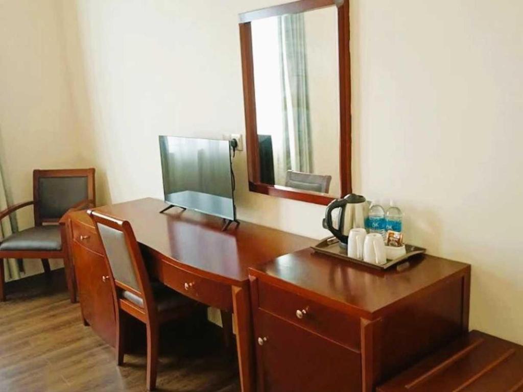 TV a/nebo společenská místnost v ubytování OYO 91037 Atari Inn