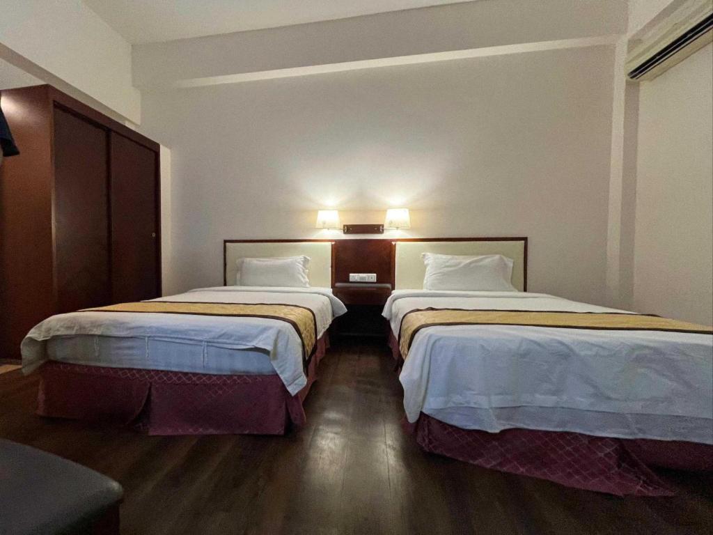 Postel nebo postele na pokoji v ubytování OYO 91037 Atari Inn