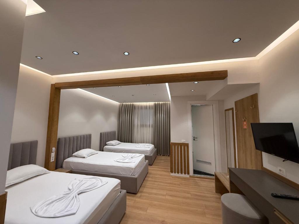 Postel nebo postele na pokoji v ubytování Hotel Colis