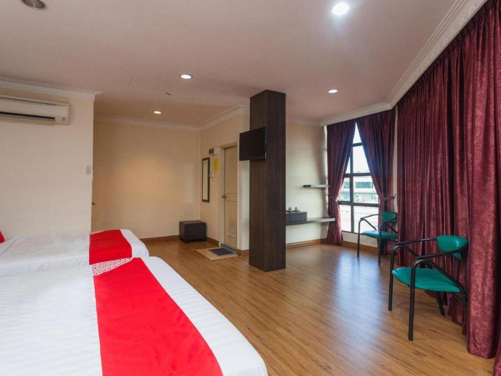 Postel nebo postele na pokoji v ubytování OYO 43915 T P Hotel