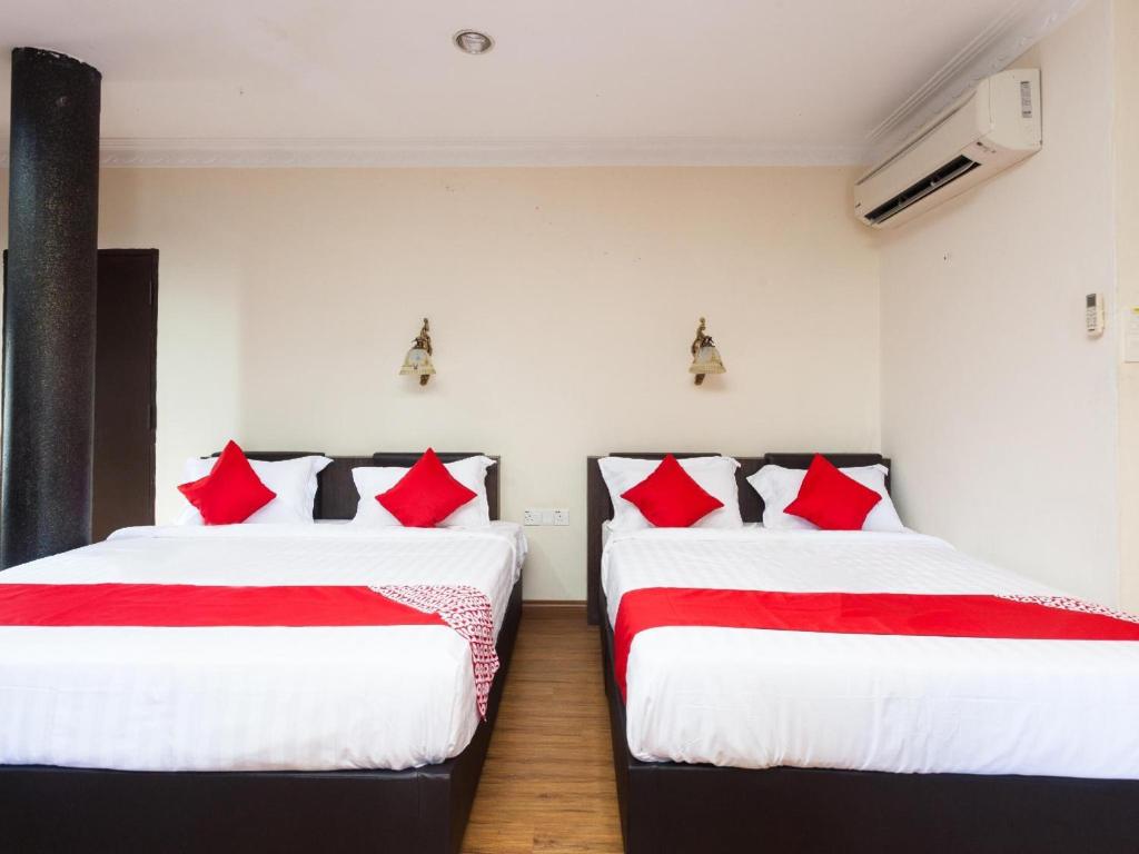 Postel nebo postele na pokoji v ubytování OYO 43915 T P Hotel
