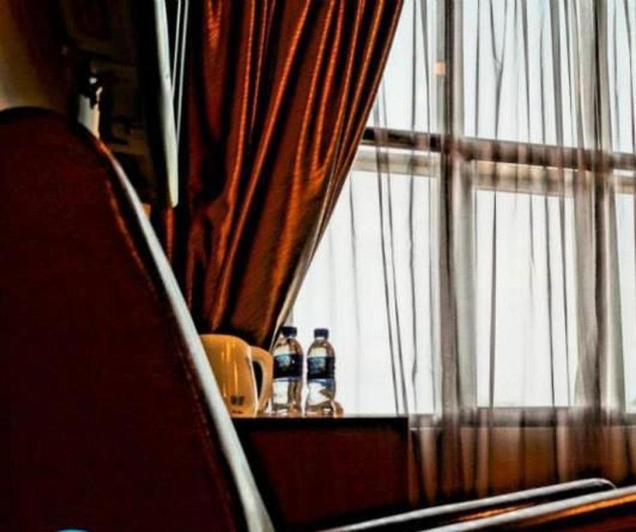 Nápoje v ubytování Capital O Rail Hotel