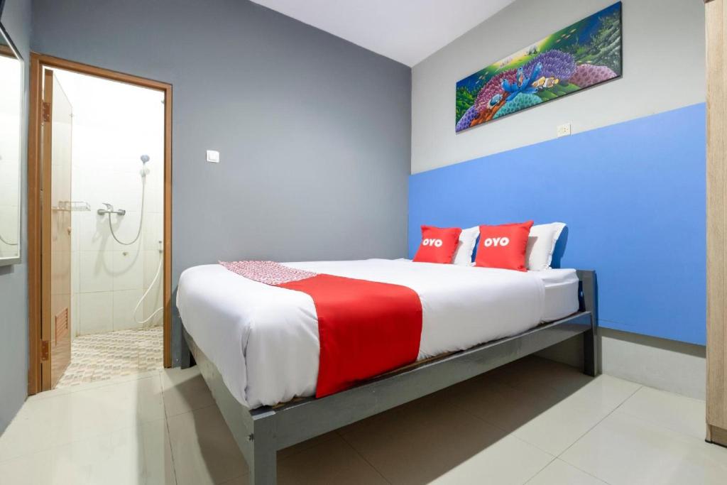 Postel nebo postele na pokoji v ubytování Hotel O Prambanan Near Prambanan Temple