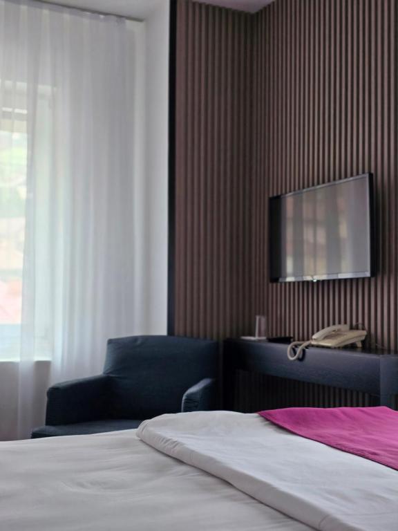 Voodi või voodid majutusasutuse Hotel Hecco toas