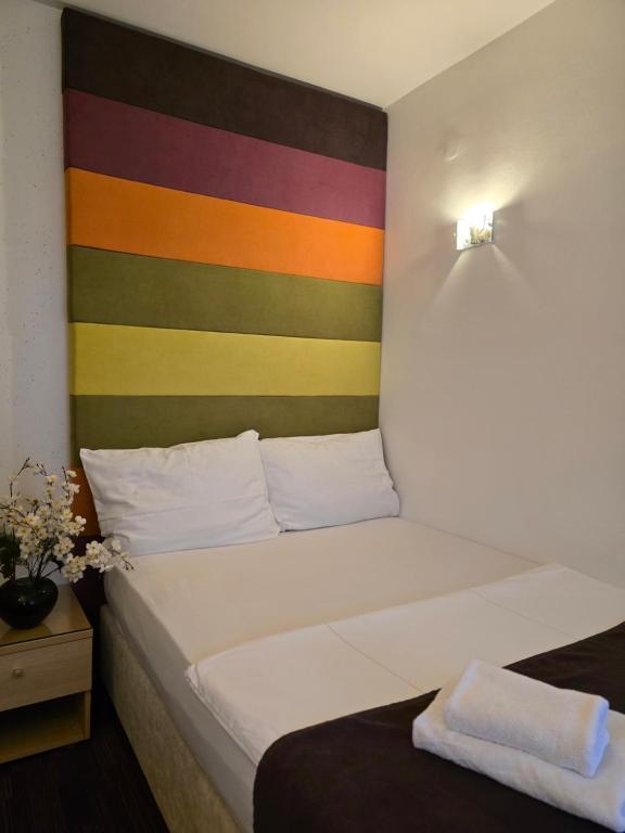Voodi või voodid majutusasutuse Hotel Hecco toas