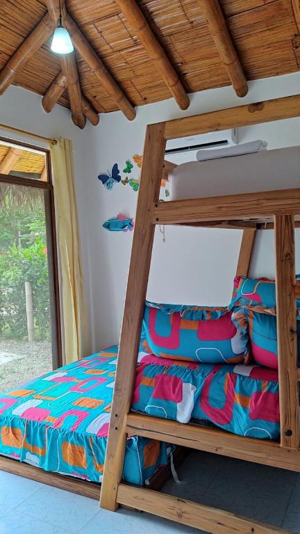 Postel nebo postele na pokoji v ubytování Cabaña de Elsa