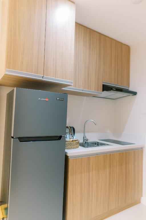 Kuchyň nebo kuchyňský kout v ubytování Palms La Union Beachfront Suites