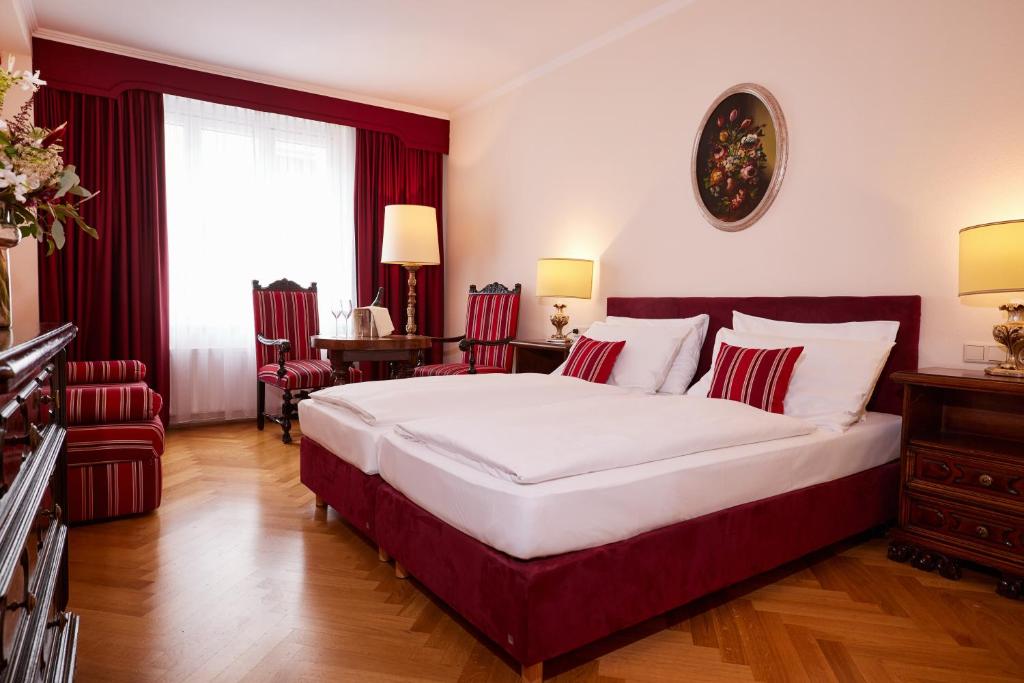 Posteľ alebo postele v izbe v ubytovaní Hotel Royal