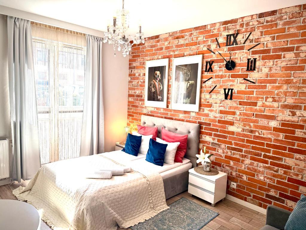 Posteľ alebo postele v izbe v ubytovaní Apartament Starogdański 6