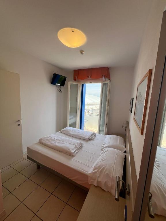 Postel nebo postele na pokoji v ubytování Villaggio Hemingway - Family Aparthotel