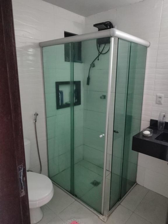 a glass shower in a bathroom with a toilet at edifício palazzo farnese in Belém