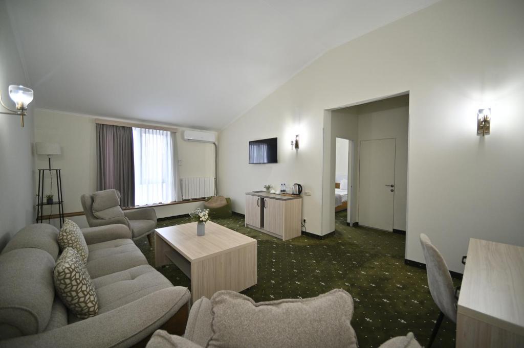 TV a/nebo společenská místnost v ubytování Colette Hotel