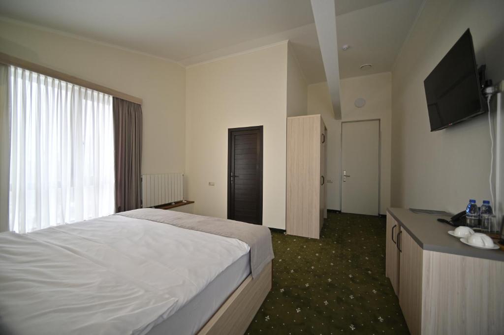 Postel nebo postele na pokoji v ubytování Colette Hotel