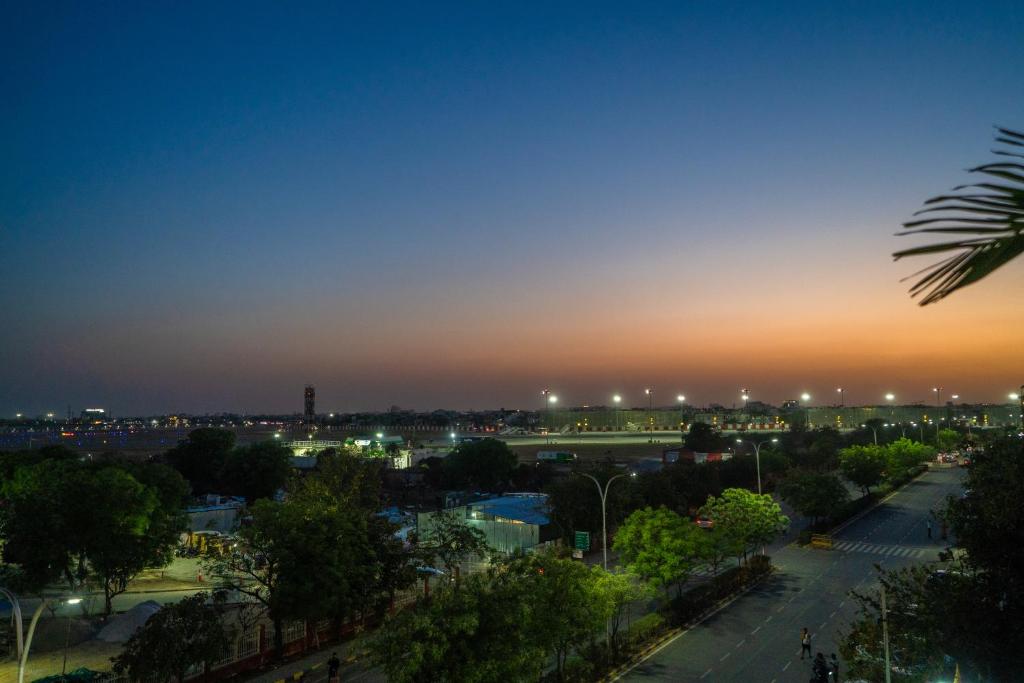 a view of a city at night at HOTEL SNOOZE in Jaipur