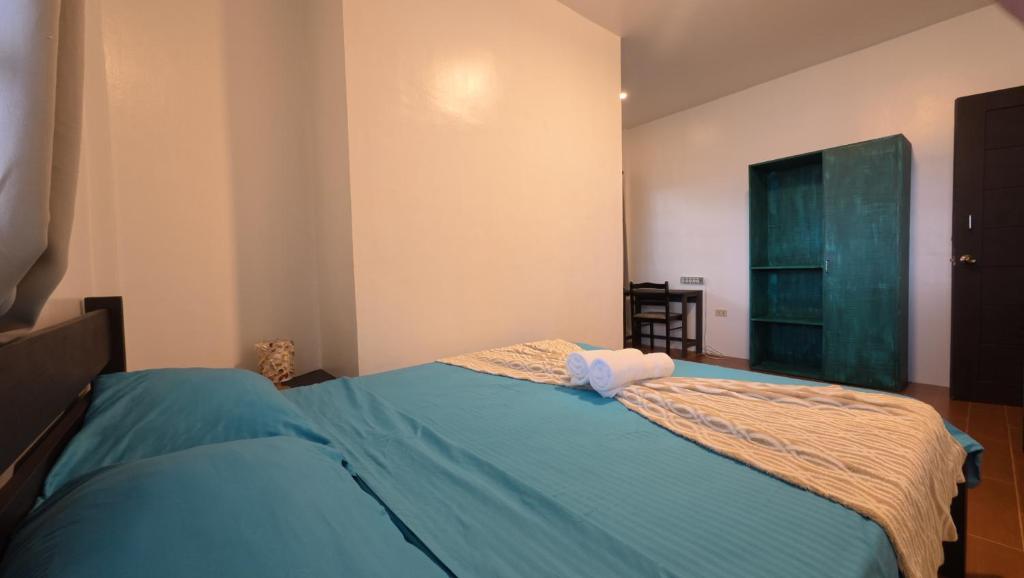 Letto o letti in una camera di FreeDive Inn
