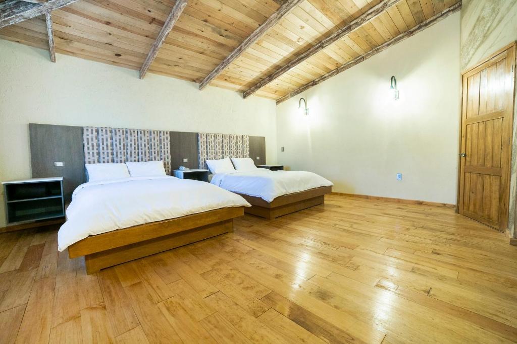 Postel nebo postele na pokoji v ubytování Collection O Casona De Minas