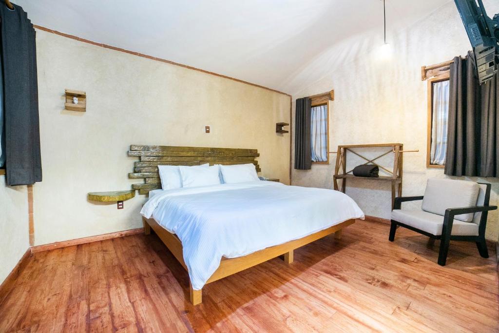 Postel nebo postele na pokoji v ubytování Collection O Casona De Minas
