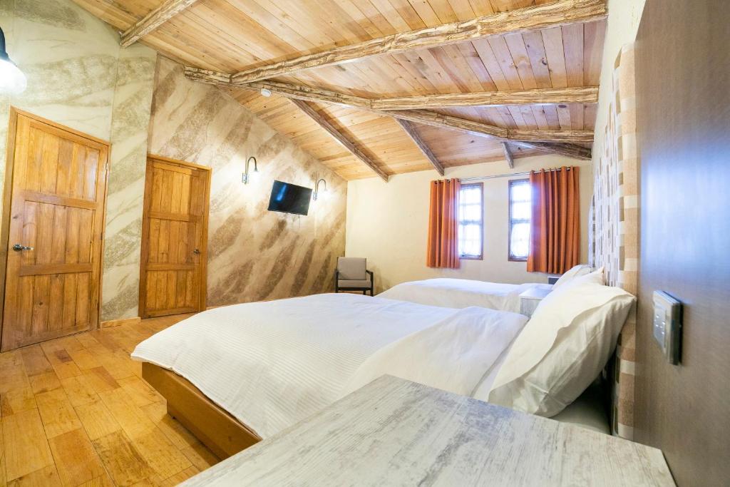 Postel nebo postele na pokoji v ubytování Collection O Casona De Minas