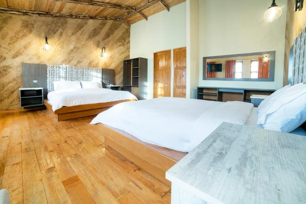 Postel nebo postele na pokoji v ubytování Collection O Casona De Minas