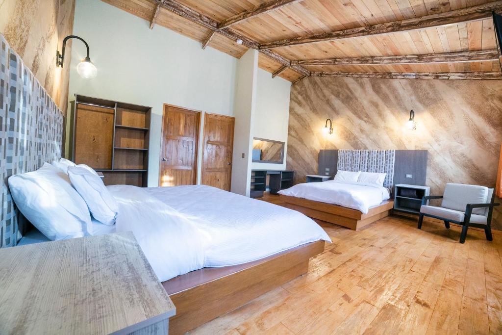 Postel nebo postele na pokoji v ubytování Collection O Casona De Minas