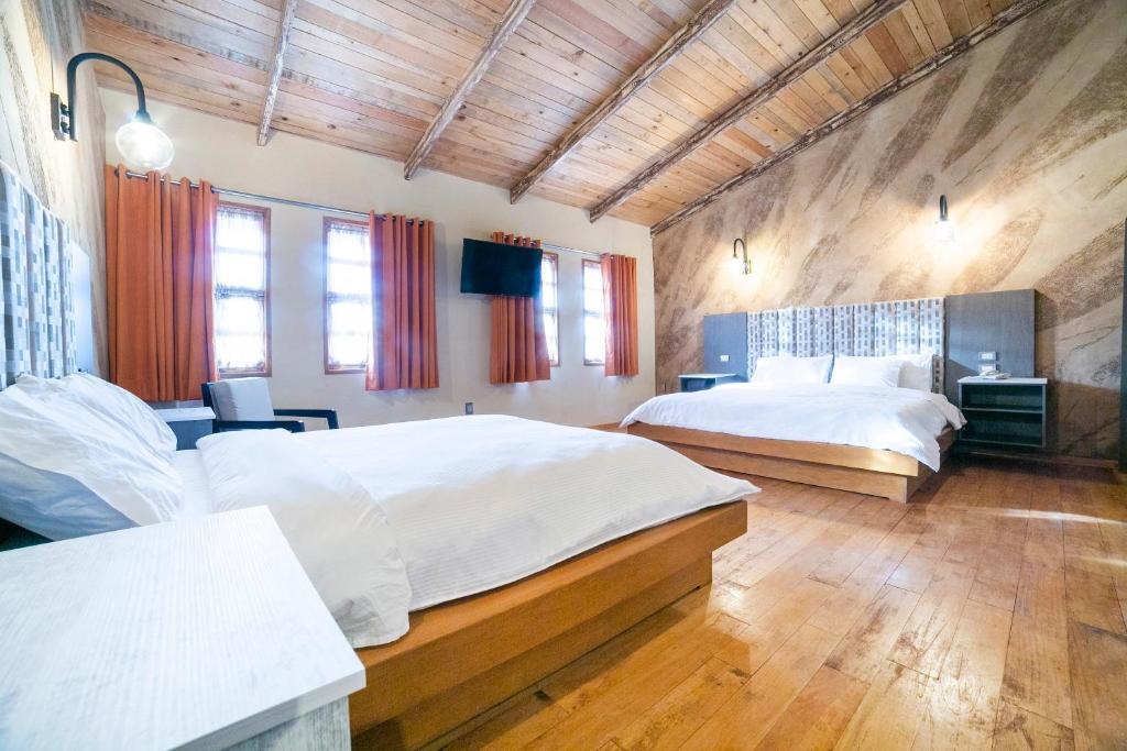 Postel nebo postele na pokoji v ubytování Collection O Casona De Minas
