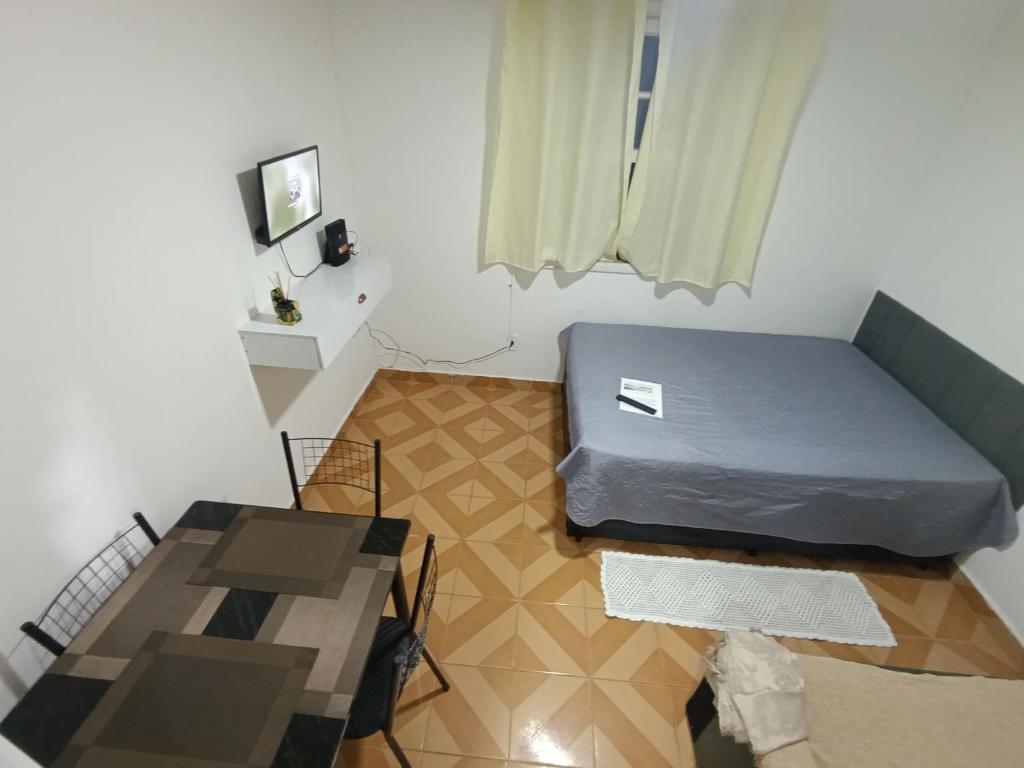 Postel nebo postele na pokoji v ubytování Kitnet Gonzaguinha