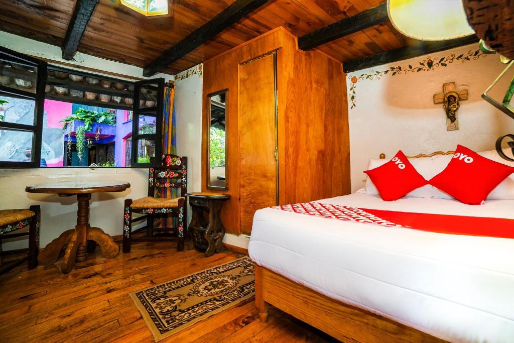 Postel nebo postele na pokoji v ubytování OYO Hotel El Mineral, Tlalpujahua
