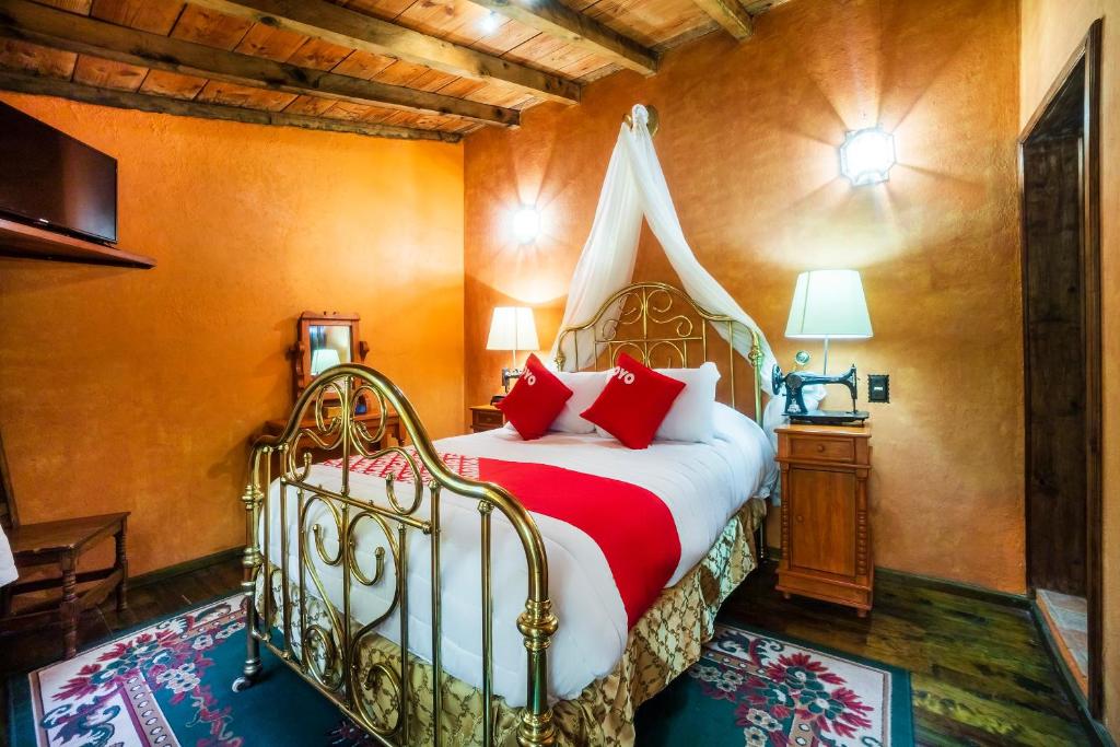 Postel nebo postele na pokoji v ubytování OYO Hotel El Mineral, Tlalpujahua