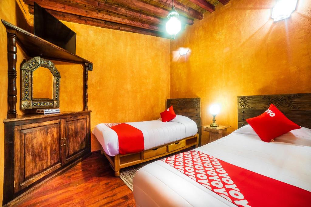 Postel nebo postele na pokoji v ubytování OYO Hotel El Mineral, Tlalpujahua