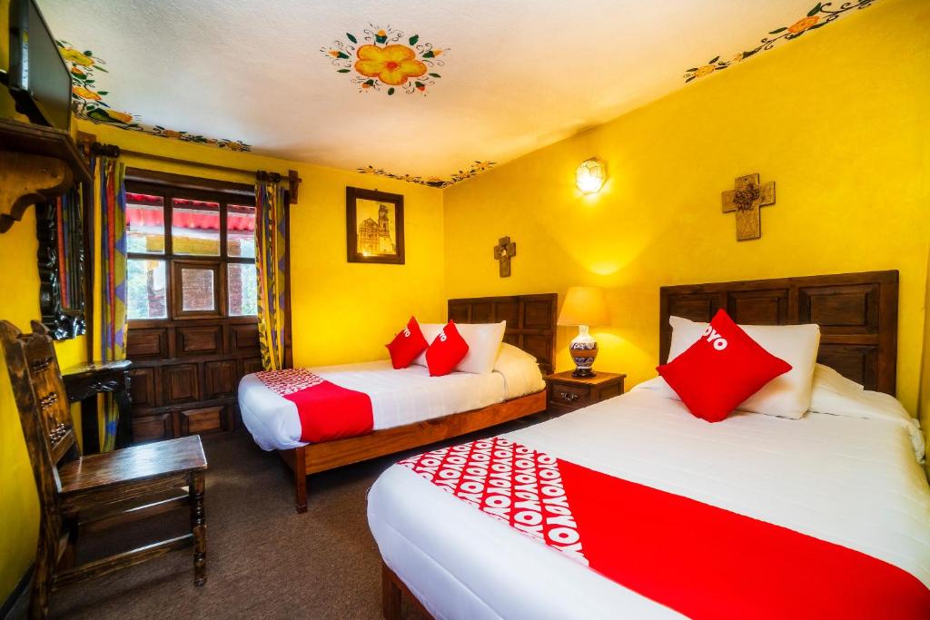 Postel nebo postele na pokoji v ubytování OYO Hotel El Mineral, Tlalpujahua