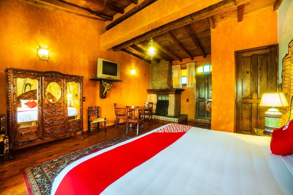 Postel nebo postele na pokoji v ubytování OYO Hotel El Mineral, Tlalpujahua