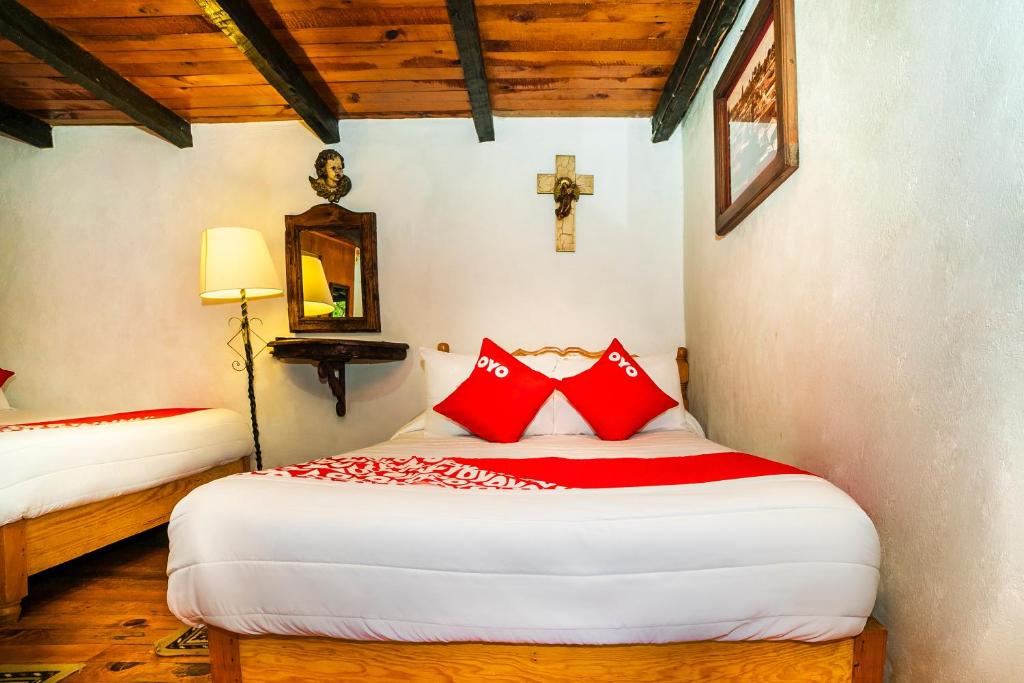 Postel nebo postele na pokoji v ubytování OYO Hotel El Mineral, Tlalpujahua