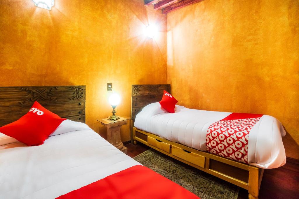 Postel nebo postele na pokoji v ubytování OYO Hotel El Mineral, Tlalpujahua