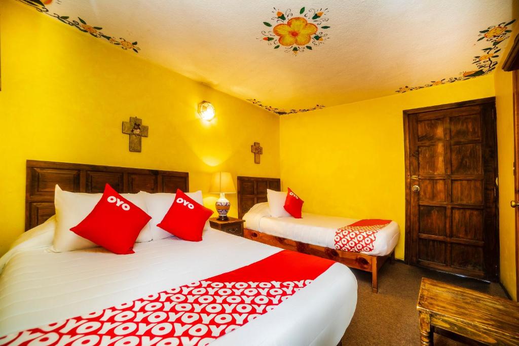 Postel nebo postele na pokoji v ubytování OYO Hotel El Mineral, Tlalpujahua