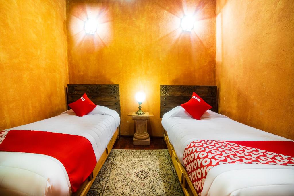 Postel nebo postele na pokoji v ubytování OYO Hotel El Mineral, Tlalpujahua
