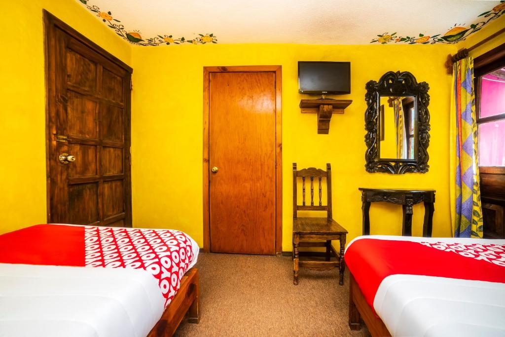 Postel nebo postele na pokoji v ubytování OYO Hotel El Mineral, Tlalpujahua