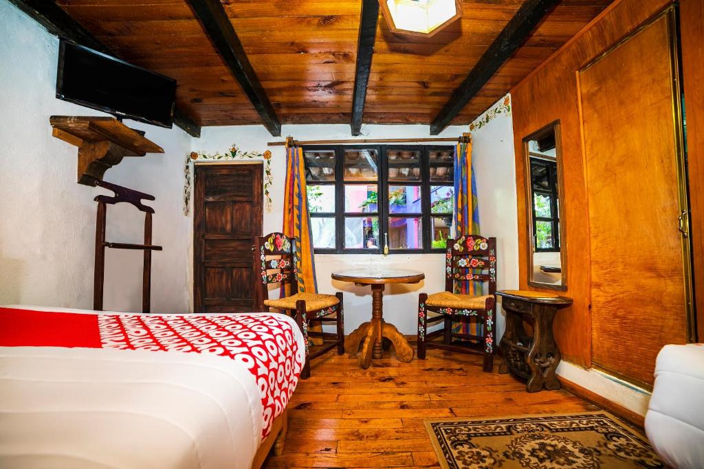 Postel nebo postele na pokoji v ubytování OYO Hotel El Mineral, Tlalpujahua