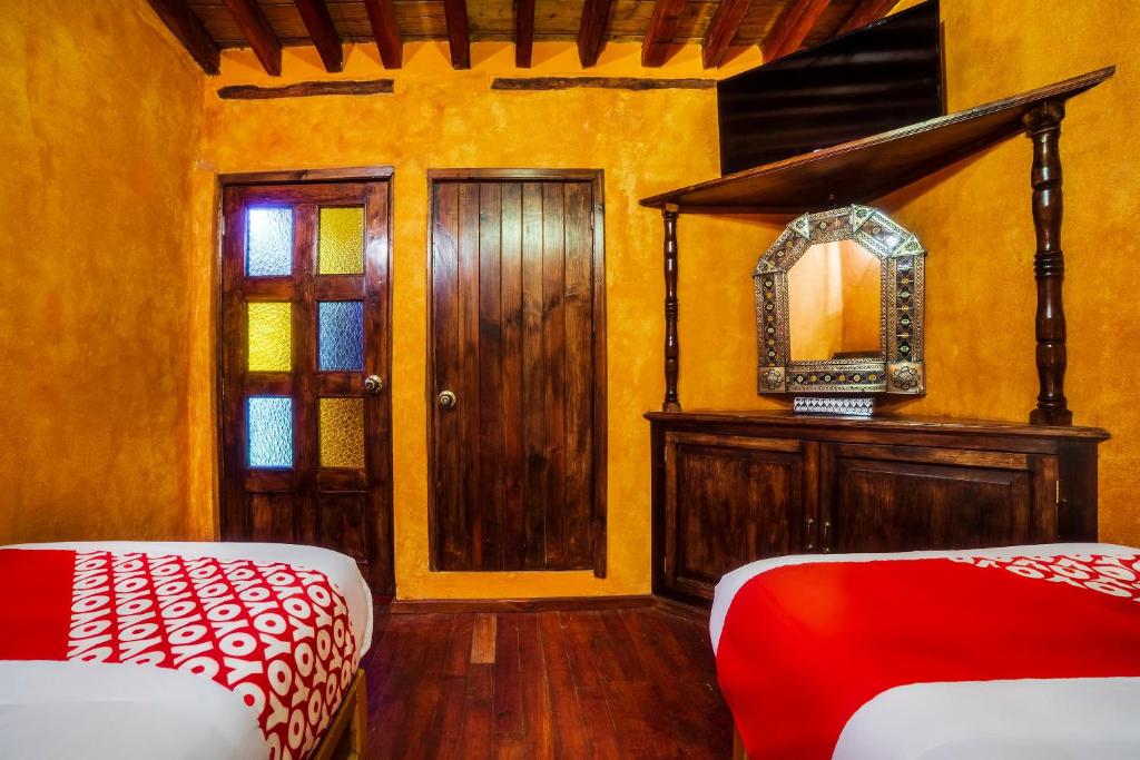 Postel nebo postele na pokoji v ubytování OYO Hotel El Mineral, Tlalpujahua