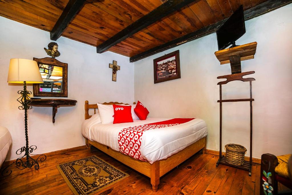 Postel nebo postele na pokoji v ubytování OYO Hotel El Mineral, Tlalpujahua