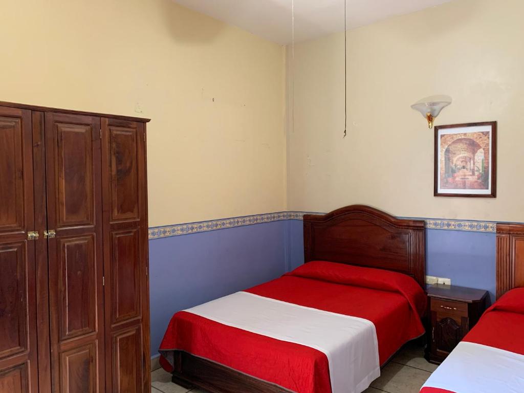 Postel nebo postele na pokoji v ubytování OYO Hotel Real de Cortés