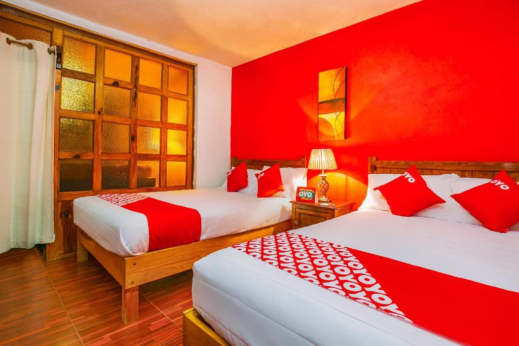 Postel nebo postele na pokoji v ubytování OYO Posada De Los Angeles, Pátzcuaro