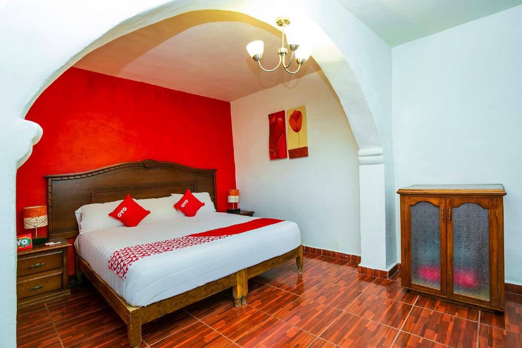 Postel nebo postele na pokoji v ubytování OYO Posada De Los Angeles, Pátzcuaro