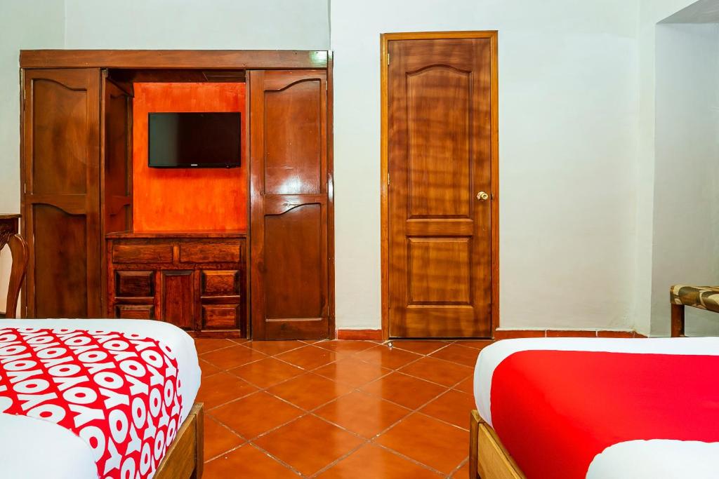 Postel nebo postele na pokoji v ubytování OYO Posada De Los Angeles, Pátzcuaro