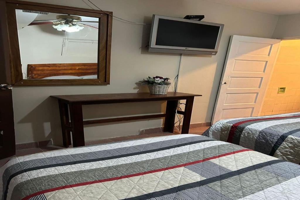 Postel nebo postele na pokoji v ubytování OYO Hotel Linda